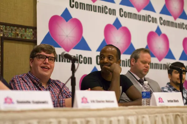 Guests seated at a past CommuniCon panel