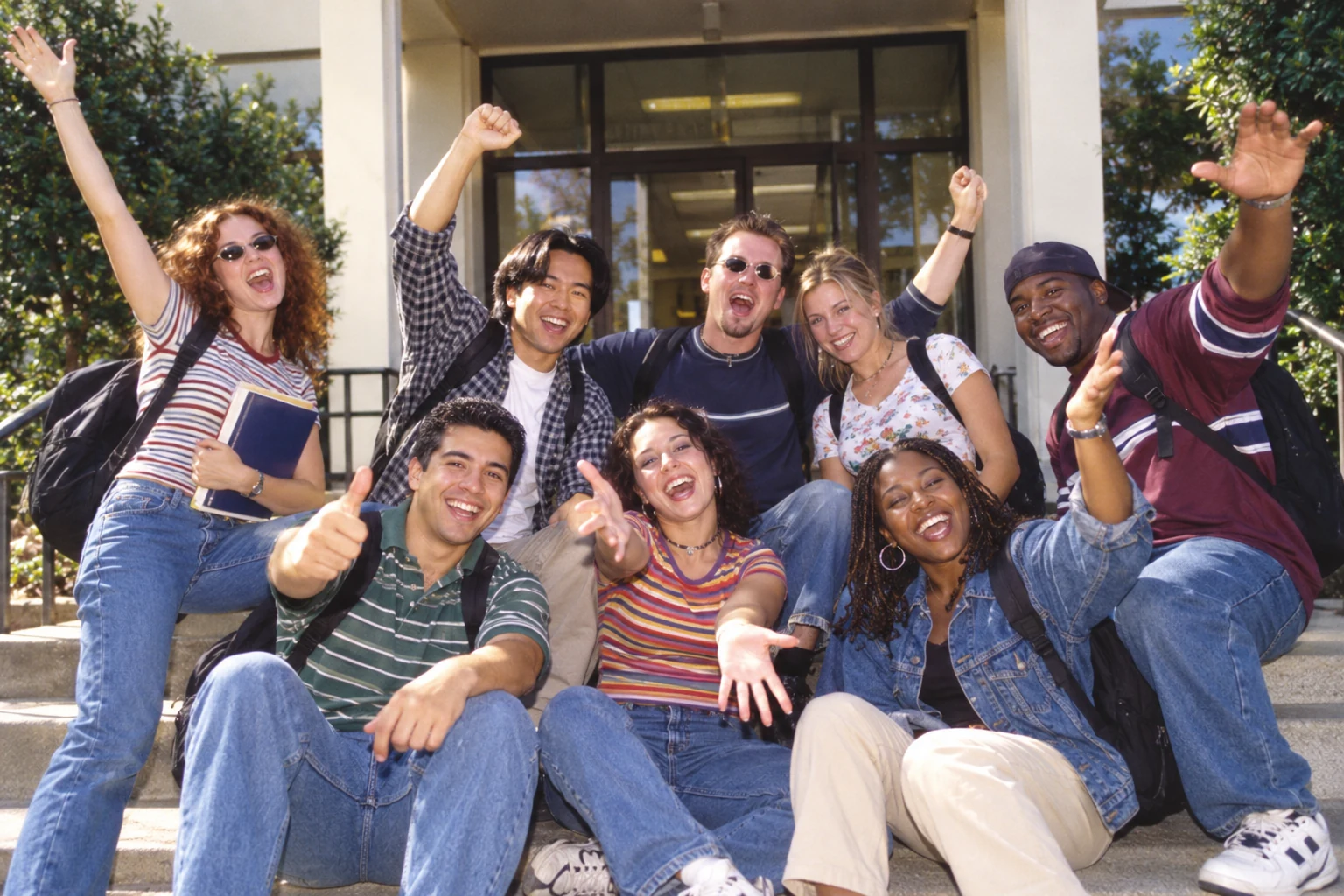 Illustrated campus spirit: a fictional group of students waving outside a college library